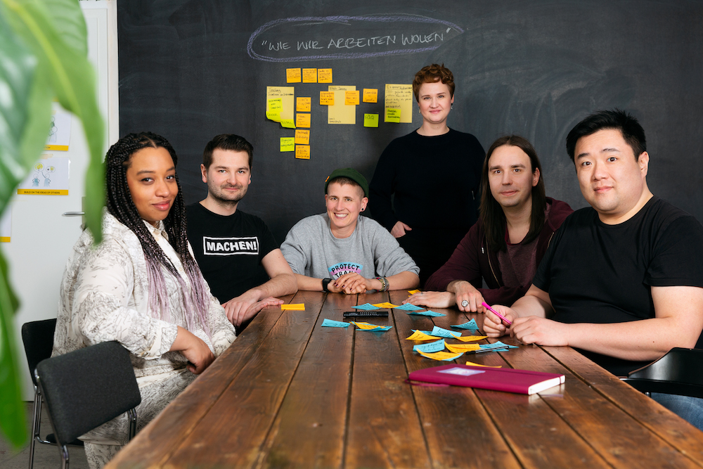 A group of diverse people sitting around a table