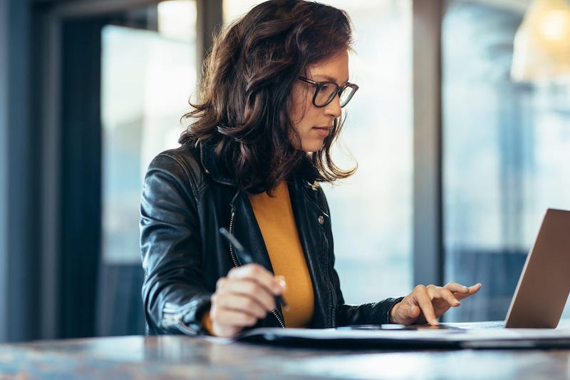 One woman learningn while working on the computer