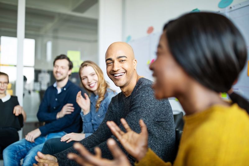 Group of employees laughing together