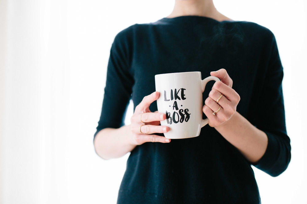 Woman with cup in hand