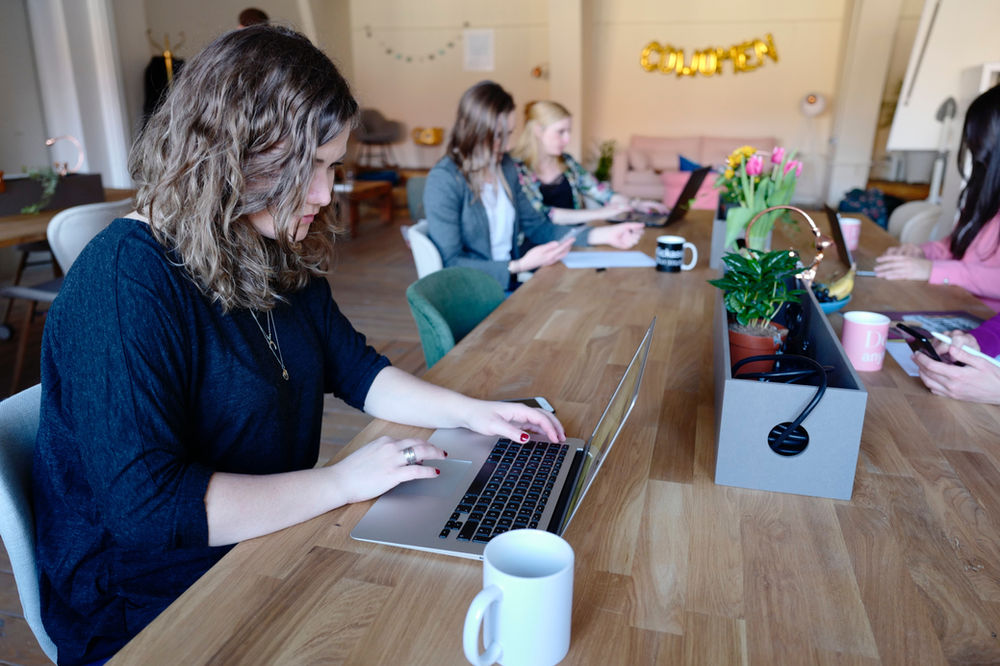 Young girl sitting at a laptop