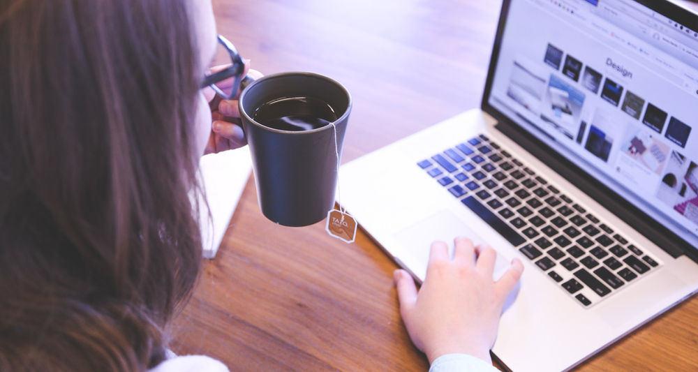 Woman looking at laptop screen